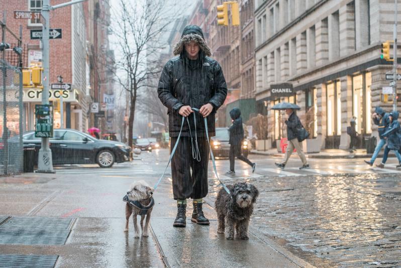 A little rain doesn't stop Michael and Laila from their daily Soho stroll. Laila prefers coatless so her curls don't get crushed.   (Photographer: Gabrielle Plucknette)